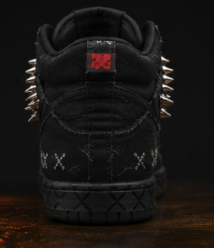 Rear view of the black high-top with the red tab and spikes flaring from both collars