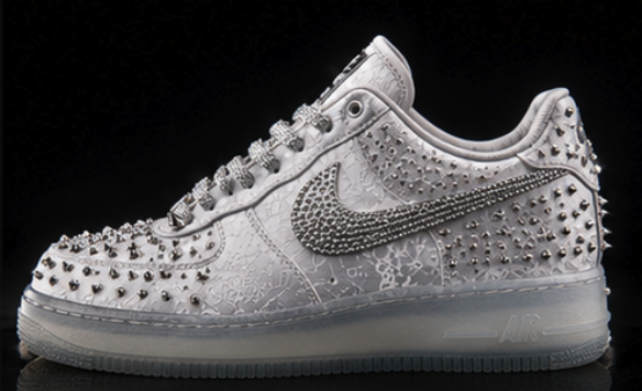 Side profile showing the crystal swoosh, spiked toe field and translucent icy sole