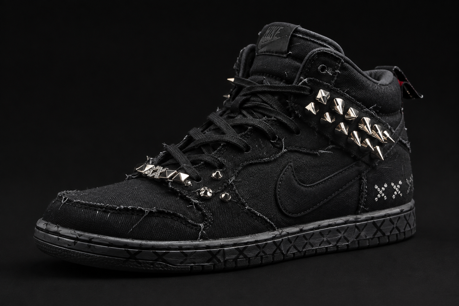 Blacked-out distressed canvas high-top with silver conical spikes along the collar and pyramid studs at the lace panel