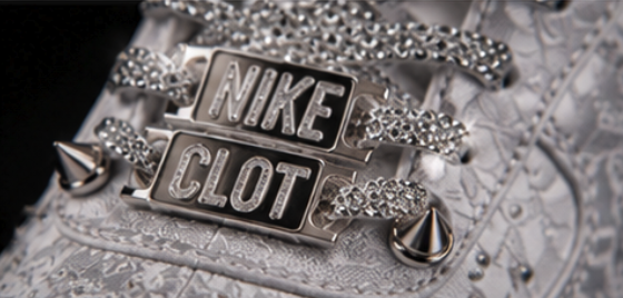 Macro of the engraved twin metal lace plates set between crystal-wrapped laces