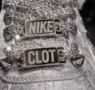 Extreme macro of crystal-wrapped laces, metal plates and conical silver spikes