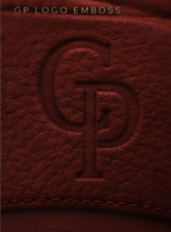 Macro of the embossed GP monogram in red leather